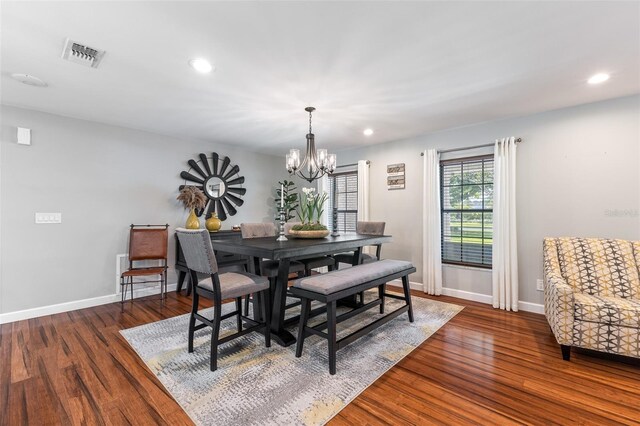 1999 Sir Lancelot Cir, Saint Cloud, FL 34772 - dining area featuring recessed lighting, dark wood finished floors, visible vents, and a notable chandelier