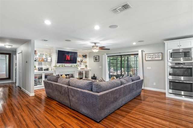 1999 Sir Lancelot Cir, Saint Cloud, FL 34772 - living area featuring ceiling fan, baseboards, wood finished floors, and visible vents