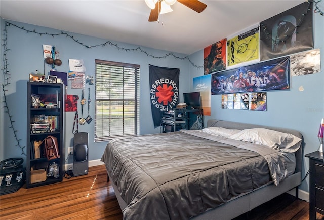 1999 Sir Lancelot Cir, Saint Cloud, FL 34772 - bedroom with baseboards, a ceiling fan, and wood finished floors