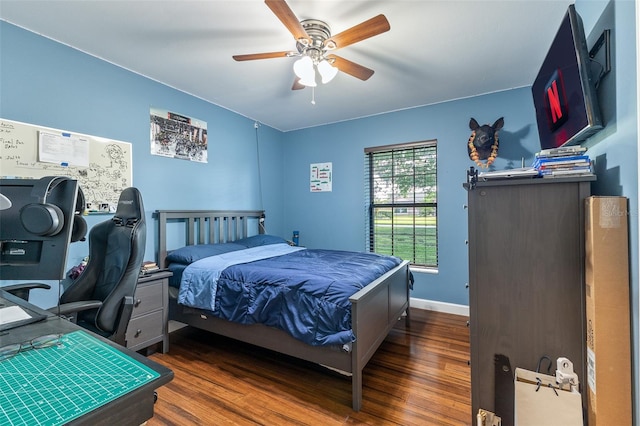 1999 Sir Lancelot Cir, Saint Cloud, FL 34772 - bedroom with baseboards, wood finished floors, and ceiling fan