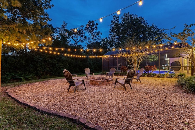 1999 Sir Lancelot Cir, Saint Cloud, FL 34772 - yard at twilight with an outdoor pool and an outdoor fire pit