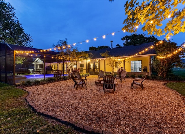 1999 Sir Lancelot Cir, Saint Cloud, FL 34772 - back of property with an outdoor pool and an outdoor fire pit