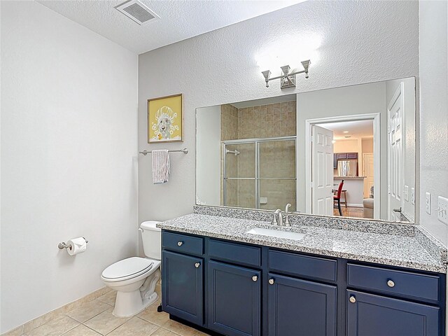 full bathroom with a textured ceiling, tile patterned floors, a stall shower, toilet, and visible vents