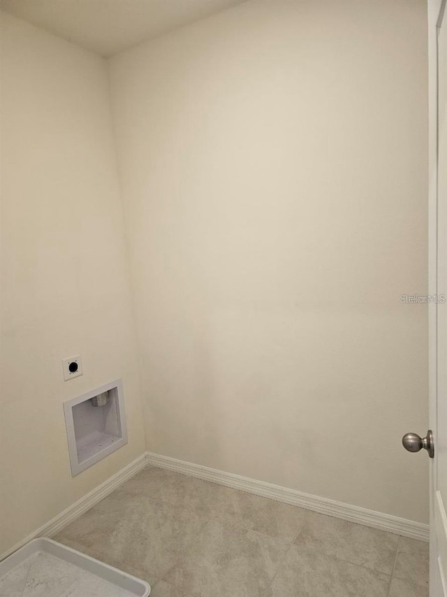 washroom featuring laundry area, light colored carpet, baseboards, and electric dryer hookup
