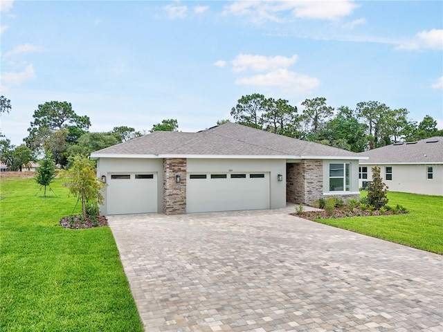 9143 Players Dr, Weeki Wachee, FL 34613 - view of front facade with an attached garage, stone siding, decorative driveway, a front lawn, and stucco siding