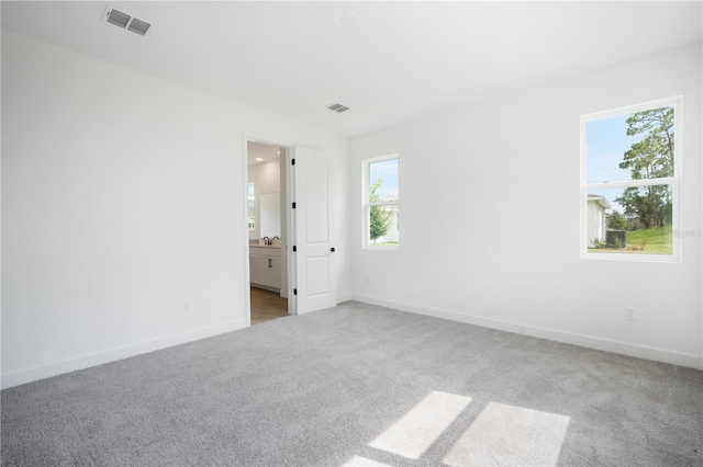 9143 Players Dr, Weeki Wachee, FL 34613 - unfurnished room featuring carpet floors and baseboards
