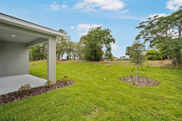 9143 Players Dr, Weeki Wachee, FL 34613 - view of grassy yard featuring a patio area