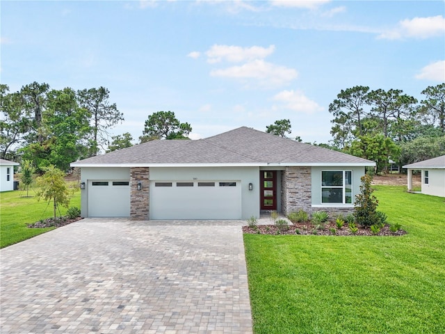 9143 Players Dr, Weeki Wachee, FL 34613 - view of front of property featuring decorative driveway, an attached garage, a front yard, stucco siding, and stone siding
