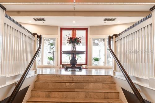 stairs featuring visible vents and recessed lighting