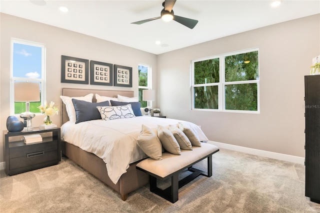 bedroom featuring a ceiling fan, baseboards, recessed lighting, and light colored carpet