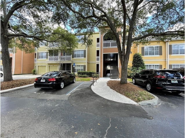 2314 Midtown Ter Unit 1113, Orlando, FL 32839 - view of property featuring uncovered parking