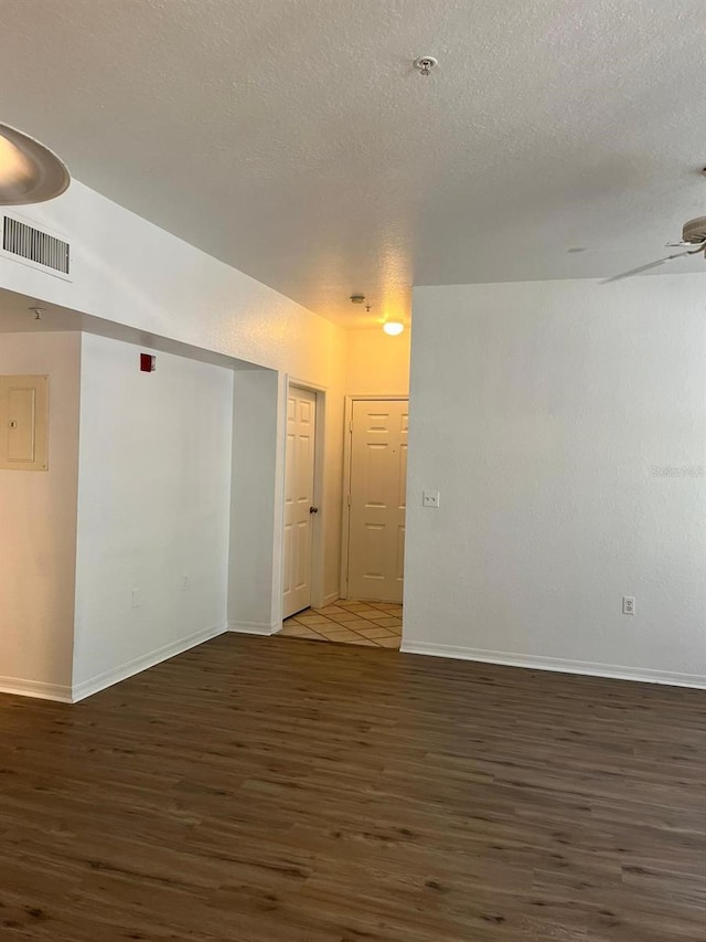 2314 Midtown Ter Unit 1113, Orlando, FL 32839 - unfurnished room featuring wood finished floors, a textured ceiling, baseboards, visible vents, and ceiling fan