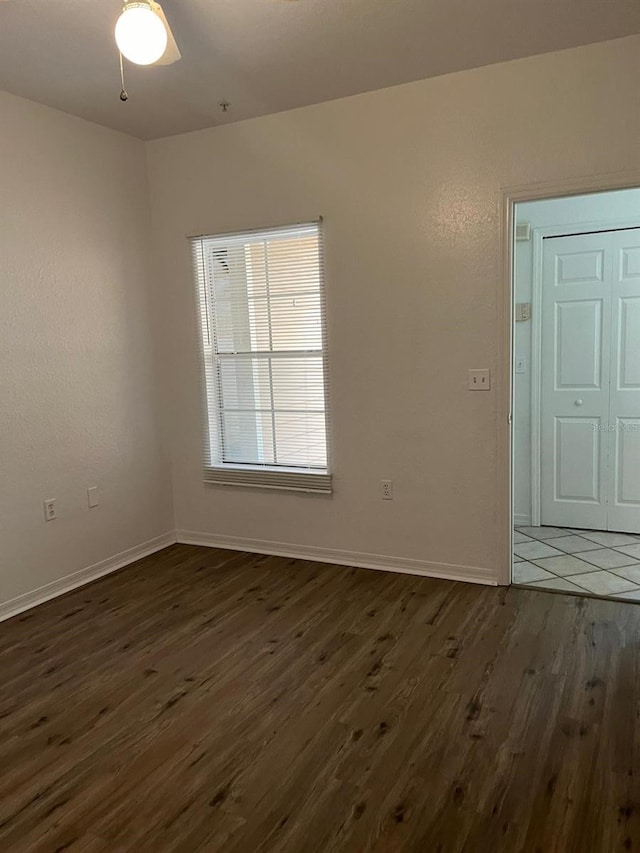 2314 Midtown Ter Unit 1113, Orlando, FL 32839 - unfurnished room with dark wood-type flooring and baseboards