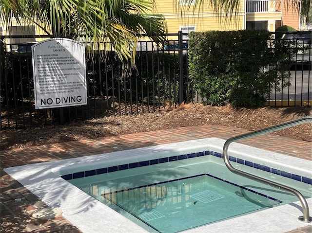 2314 Midtown Ter Unit 1113, Orlando, FL 32839 - view of swimming pool with a hot tub and fence