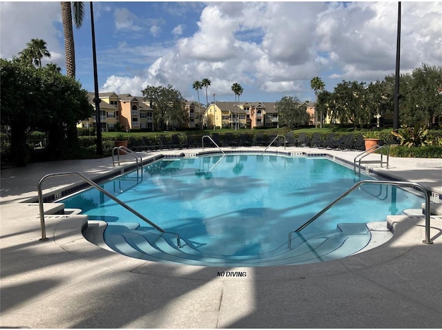 2314 Midtown Ter Unit 1113, Orlando, FL 32839 - community pool with a residential view and a patio area