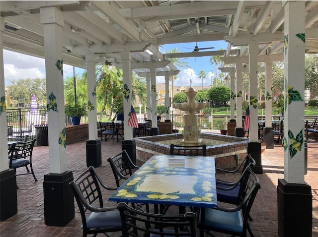 2314 Midtown Ter Unit 1113, Orlando, FL 32839 - view of patio featuring outdoor dining area and fence