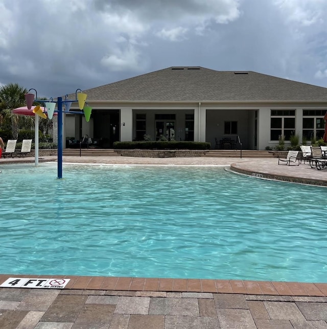 1907 Partin Terrace Rd, Kissimmee, FL 34744 - community pool with a patio