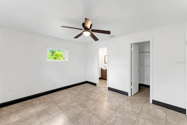710 E Court, Longwood, FL 32750 - unfurnished bedroom with a closet, visible vents, baseboards, a ceiling fan, and a walk in closet