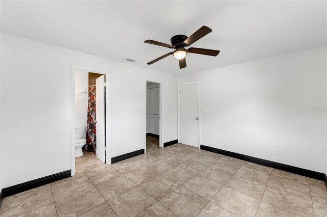 710 E Court, Longwood, FL 32750 - unfurnished bedroom featuring a walk in closet, baseboards, ceiling fan, visible vents, and a closet