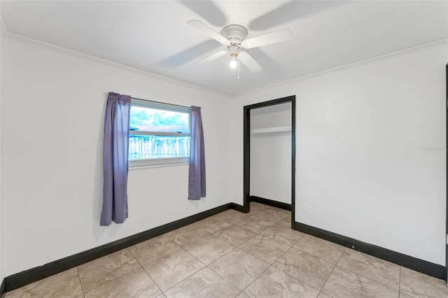 710 E Court, Longwood, FL 32750 - unfurnished bedroom with a closet, crown molding, baseboards, a ceiling fan, and light tile patterned floors