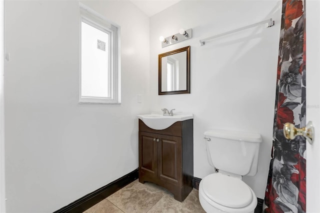 710 E Court, Longwood, FL 32750 - full bathroom with baseboards, toilet, tile patterned flooring, and vanity