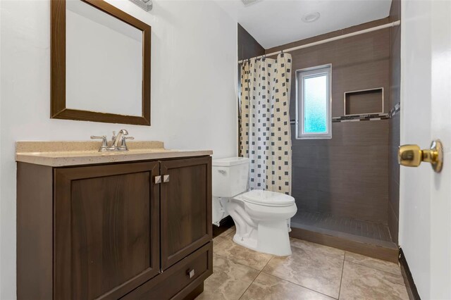710 E Court, Longwood, FL 32750 - bathroom with vanity, toilet, and tiled shower