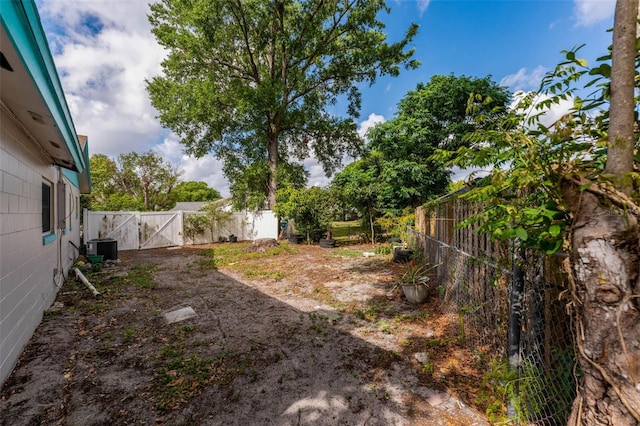 710 E Court, Longwood, FL 32750 - view of yard with central AC, a gate, and a fenced backyard