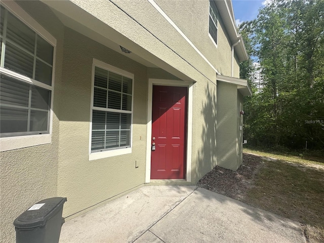 10595 Regent Square Dr Unit 1208, Orlando, FL 32825 - doorway to property featuring stucco siding