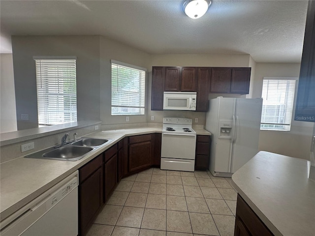10595 Regent Square Dr Unit 1208, Orlando, FL 32825 - kitchen with light countertops, a sink, light tile patterned flooring, and white appliances