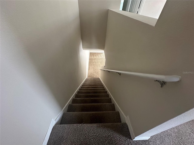 10595 Regent Square Dr Unit 1208, Orlando, FL 32825 - staircase featuring baseboards and carpet flooring