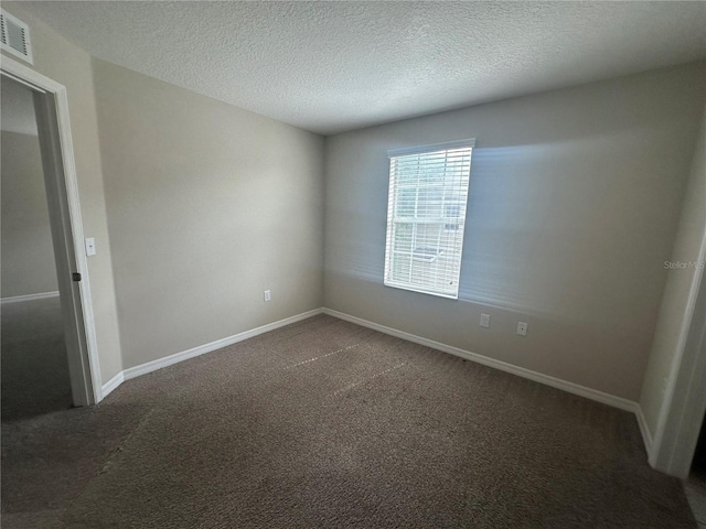 10595 Regent Square Dr Unit 1208, Orlando, FL 32825 - carpeted empty room featuring baseboards, visible vents, and a textured ceiling