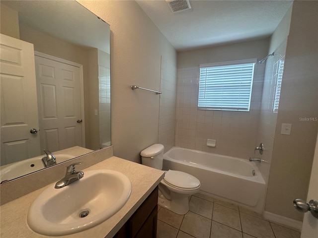 10595 Regent Square Dr Unit 1208, Orlando, FL 32825 - bathroom with visible vents, toilet, tile patterned floors, vanity, and shower / tub combination
