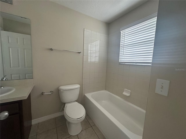 10595 Regent Square Dr Unit 1208, Orlando, FL 32825 - full bath with tile patterned floors, toilet, vanity, a tub, and baseboards