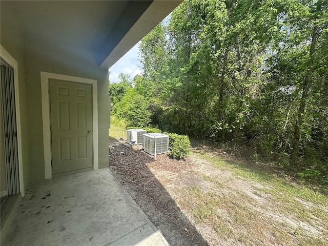 10595 Regent Square Dr Unit 1208, Orlando, FL 32825 - view of yard featuring central air condition unit