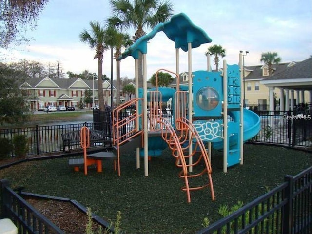10595 Regent Square Dr Unit 1208, Orlando, FL 32825 - community play area with fence and a residential view
