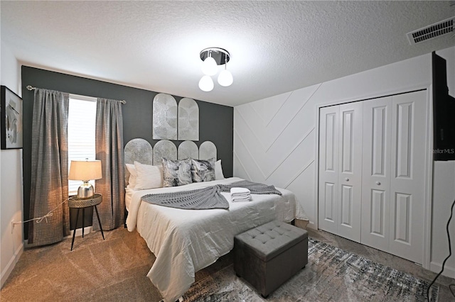 4221 Paragraph Dr, Kissimmee, FL 34746 - bedroom with carpet, a closet, a textured ceiling, and visible vents