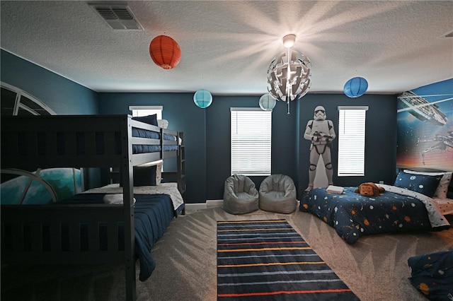 4221 Paragraph Dr, Kissimmee, FL 34746 - carpeted bedroom featuring a textured ceiling and visible vents