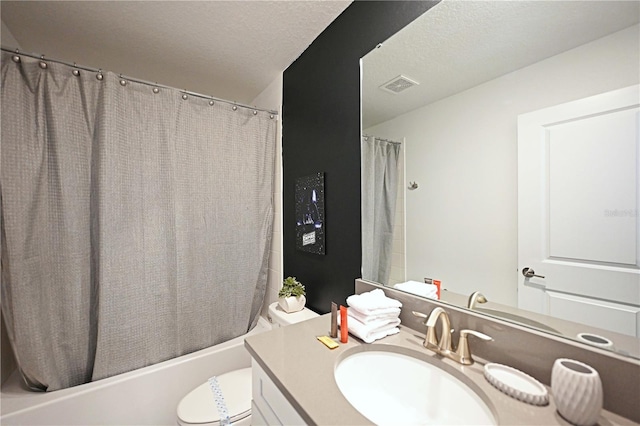 4221 Paragraph Dr, Kissimmee, FL 34746 - full bathroom with visible vents, toilet, vanity, and a textured ceiling