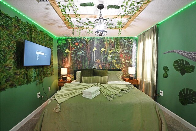 4221 Paragraph Dr, Kissimmee, FL 34746 - carpeted bedroom featuring baseboards and a chandelier