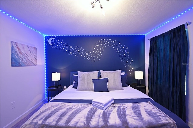 4221 Paragraph Dr, Kissimmee, FL 34746 - bedroom with baseboards and a textured ceiling