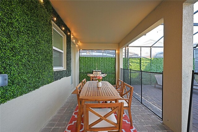 4221 Paragraph Dr, Kissimmee, FL 34746 - view of patio / terrace featuring glass enclosure