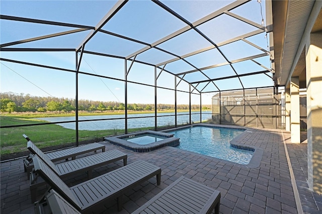 4221 Paragraph Dr, Kissimmee, FL 34746 - view of swimming pool with glass enclosure, a water view, a patio, and a pool with connected hot tub