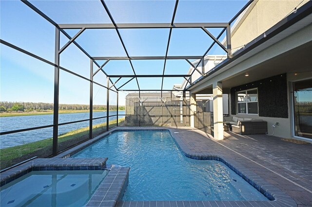 4221 Paragraph Dr, Kissimmee, FL 34746 - view of pool with glass enclosure, a pool with connected hot tub, a water view, and a patio