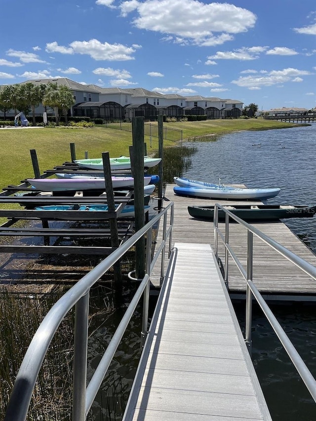 4221 Paragraph Dr, Kissimmee, FL 34746 - dock area featuring a water view and a yard