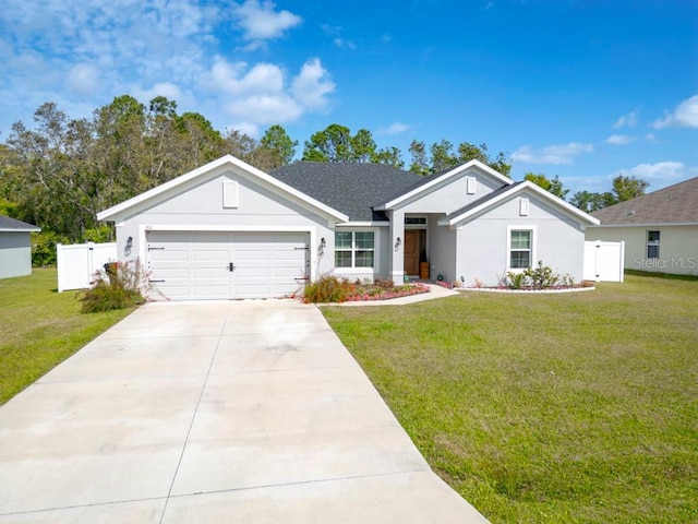 311 Athabasca Pl, Kissimmee, FL 34759 - ranch-style house featuring a gate, fence, an attached garage, concrete driveway, and a front lawn