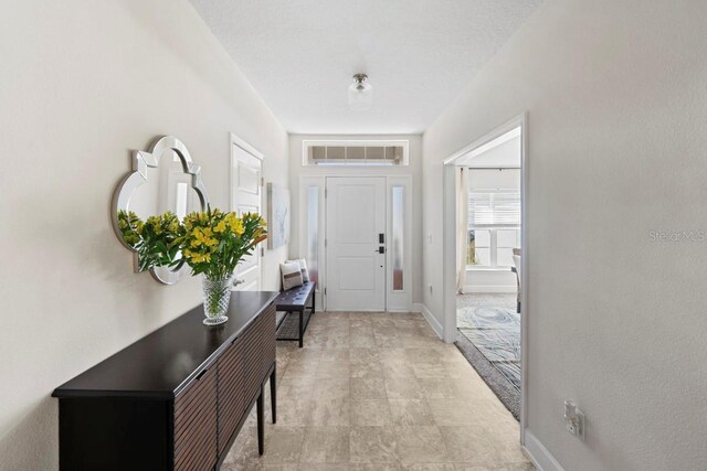 311 Athabasca Pl, Kissimmee, FL 34759 - foyer entrance with baseboards and visible vents