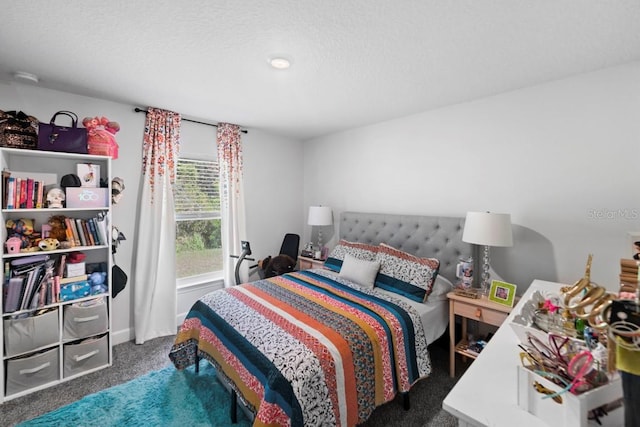 311 Athabasca Pl, Kissimmee, FL 34759 - carpeted bedroom featuring a textured ceiling