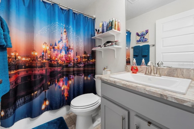 311 Athabasca Pl, Kissimmee, FL 34759 - full bathroom with toilet, vanity, and a shower with shower curtain