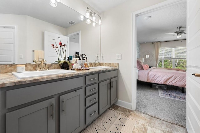 311 Athabasca Pl, Kissimmee, FL 34759 - bathroom featuring double vanity, a sink, ensuite bathroom, and visible vents