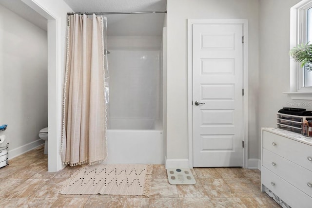311 Athabasca Pl, Kissimmee, FL 34759 - full bath with baseboards, shower / tub combo with curtain, toilet, and vanity